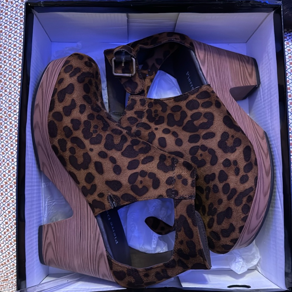 Closed toed wedges. Leopard print great condition.  Comes with box.